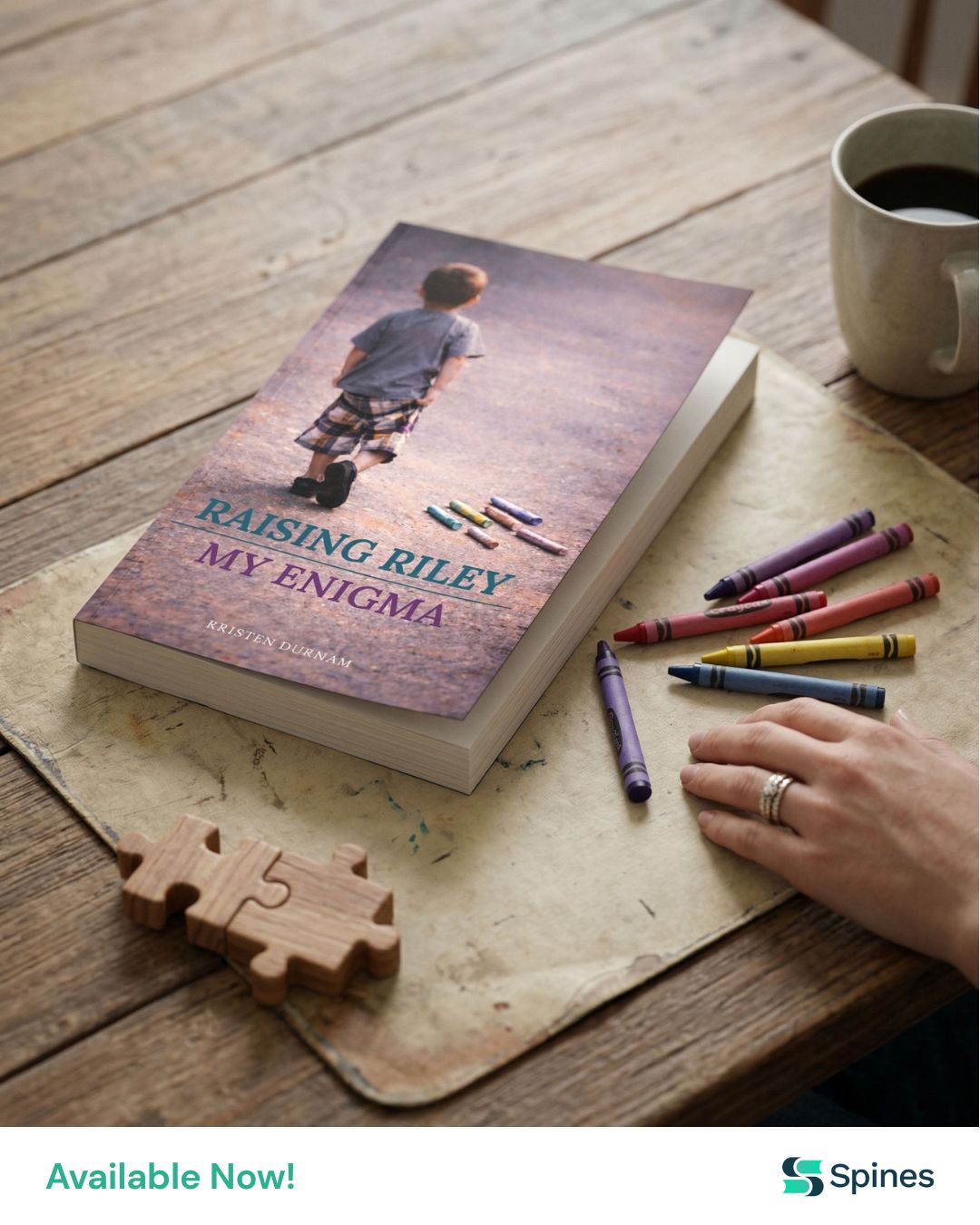 Raising Riley, My Enigma — paperback by Kristen Durham, photographed with crayons and a coffee mug